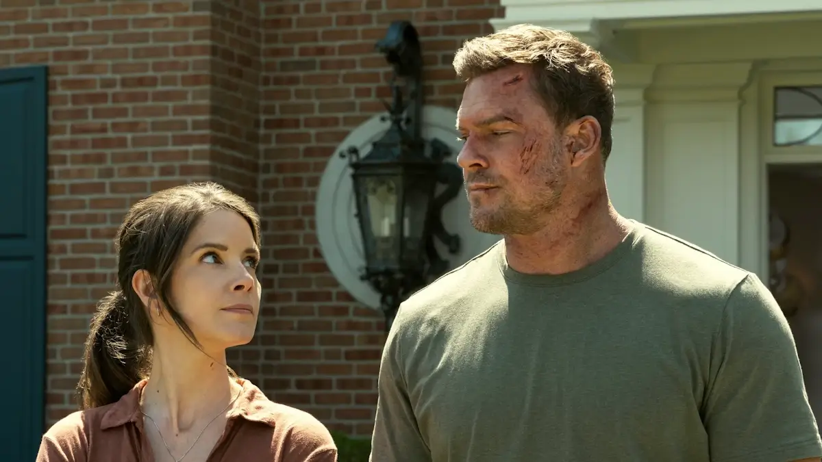 Alan Ritchson as Jack Reacher with a supporting character in a scene from the Prime Video series Reacher