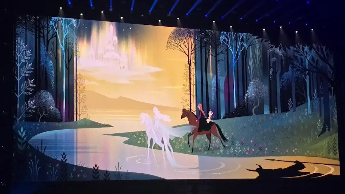 Frozen 3 official concept art revealed at D23 2024 showing Anna riding a brown horse with Olaf, Elsa riding the white Nokk spirit horse, a glowing castle in the distance, and a shadowy horned figure visible in the bottom right corner
