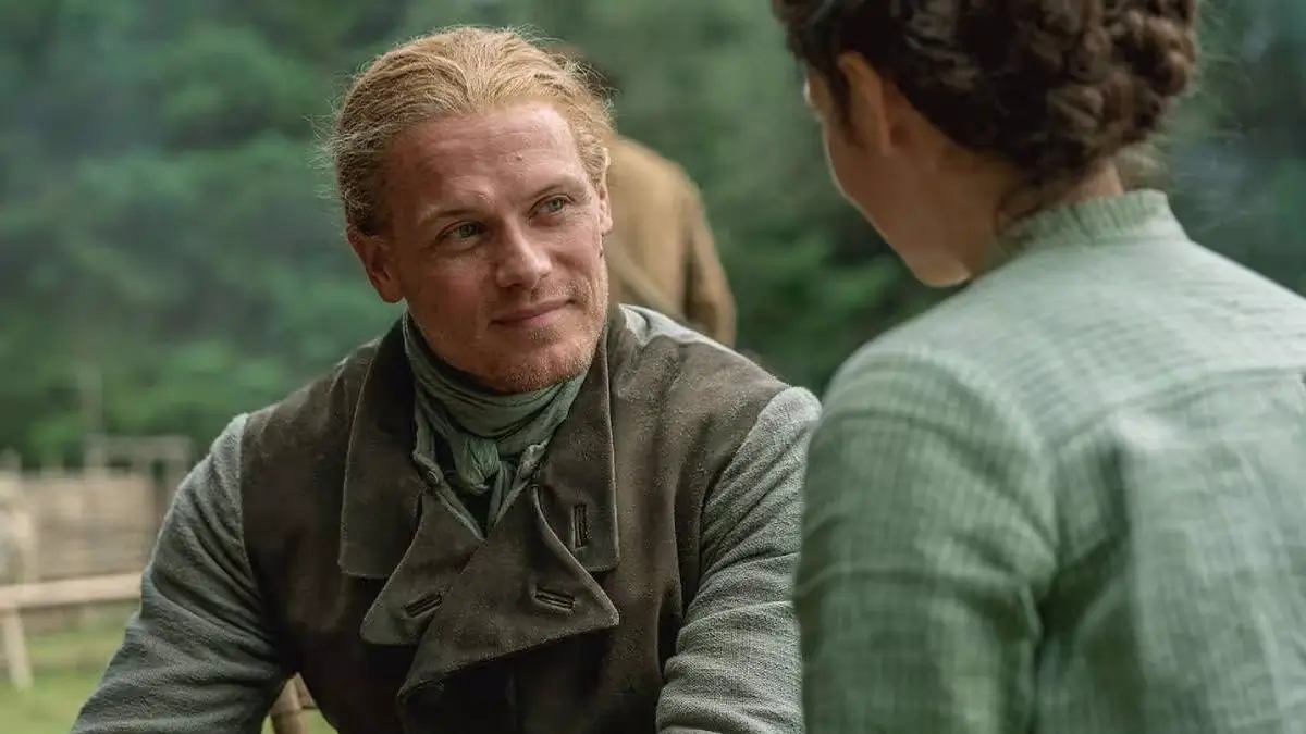 Sam Heughan and Caitríona Balfe as Jamie and Claire Fraser at Fraser's Ridge in Outlander Season 8 on Starz